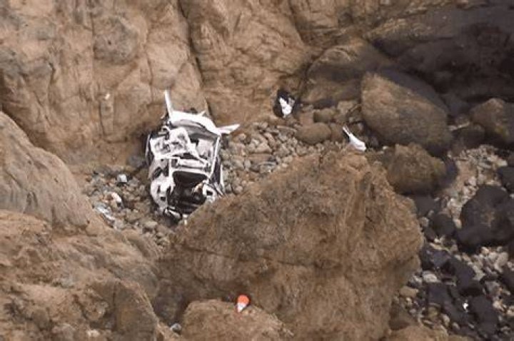 
Driver of Tesla That Went 250 Feet Over Calif. Cliff Arrested for Attempted Murder and Child Abuse 