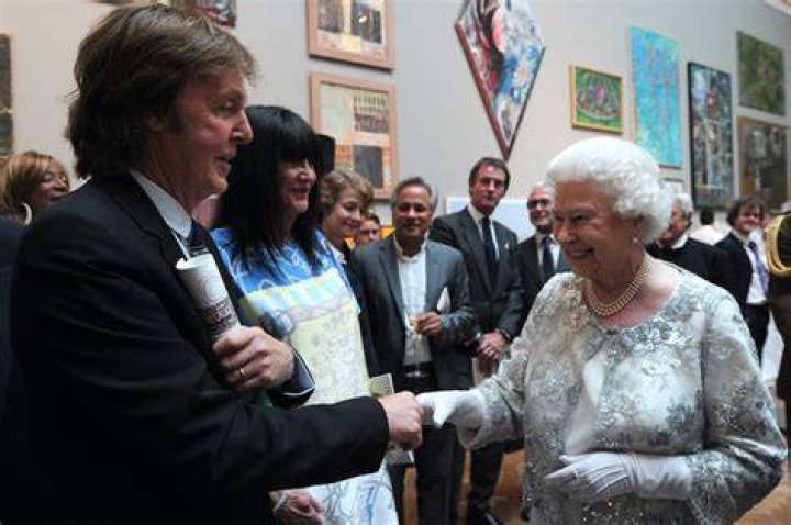 
Paul McCartney Whispered to Queen Elizabeth II and Made Her Laugh the Last Time They Met 